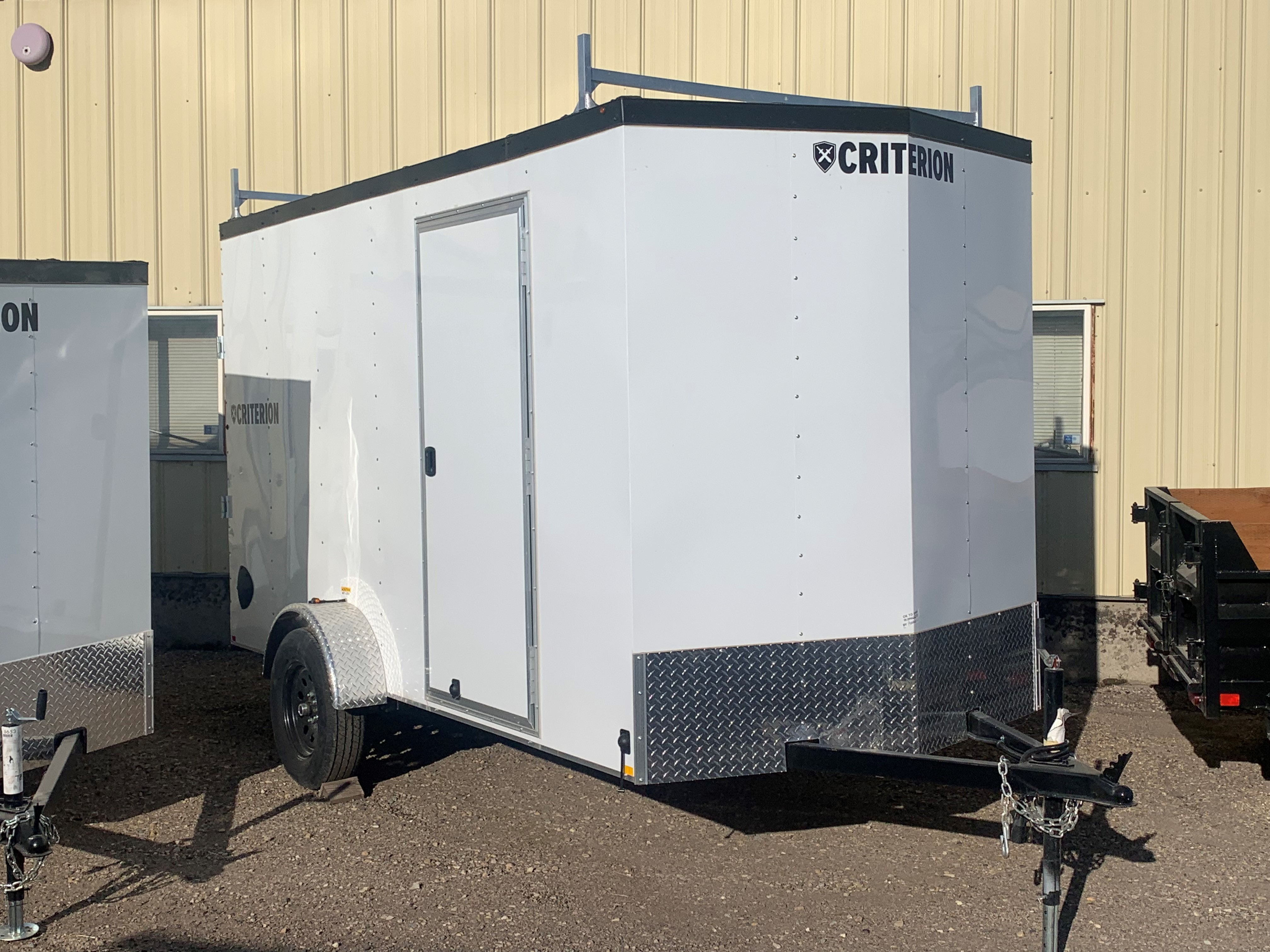 6' x 12' Criterion enclosed cargo utility trailer with rear ramp door.