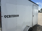 6' x 12' Criterion enclosed cargo utility trailer with rear ramp door.